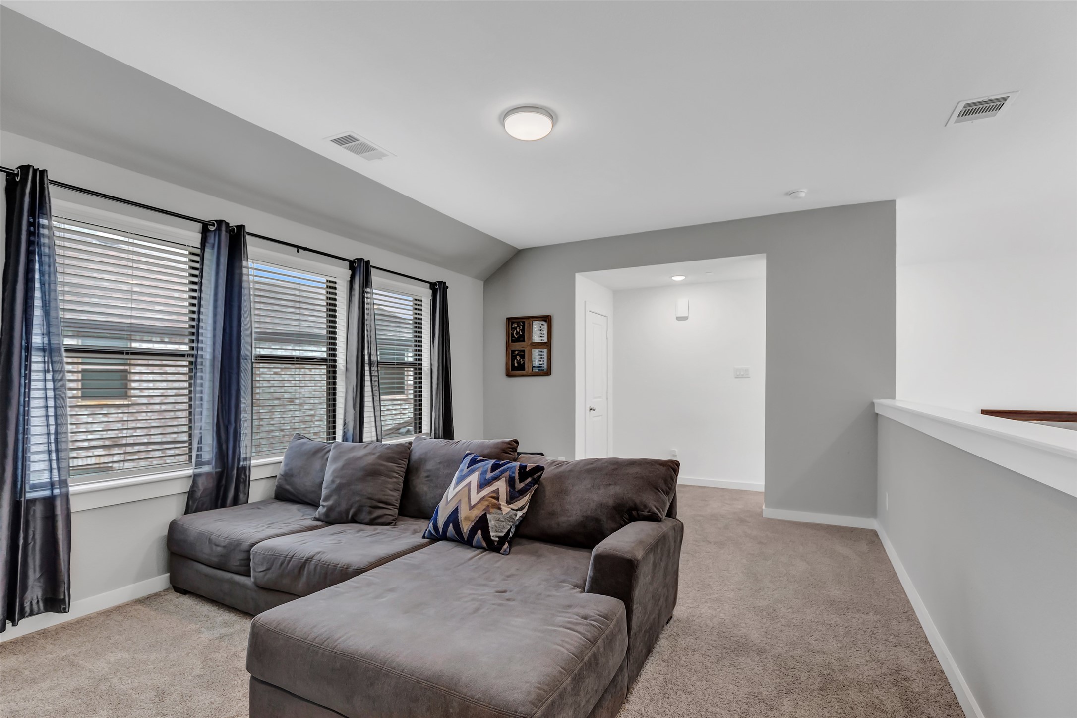 527 Chestnut Reef Court Conroe, TX 77304 - Photo 26 of 40 a living room with a couch and a window