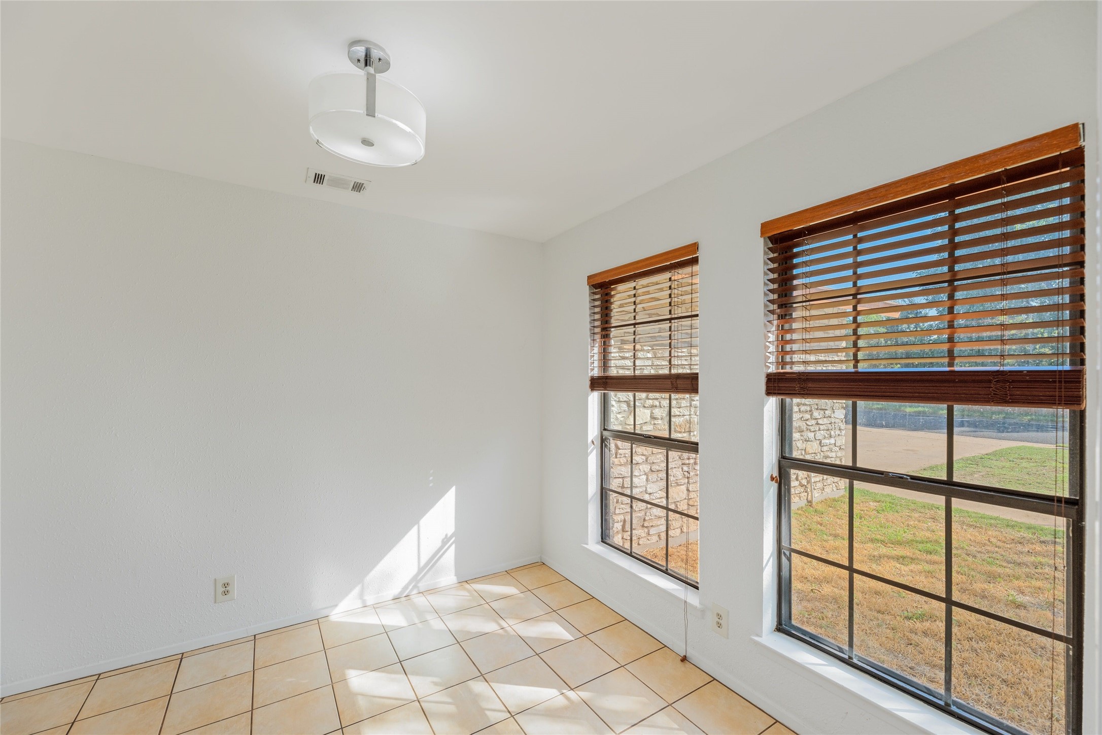 13406 Effingham Street Austin, TX 78729 - Photo 13 of 32 a view of an empty room with a window