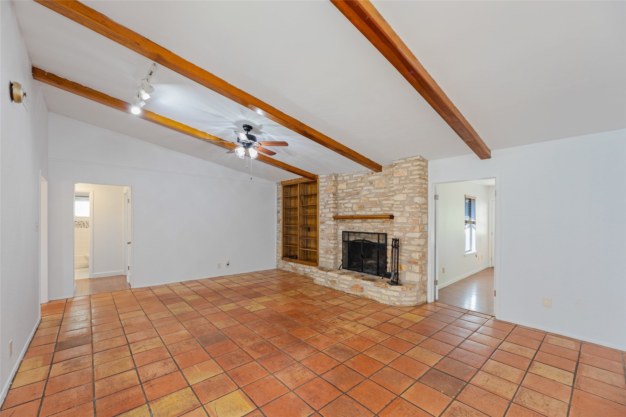 13406 Effingham Street Austin, TX 78729 - Photo 2 of 32 a view of empty room with wooden floor