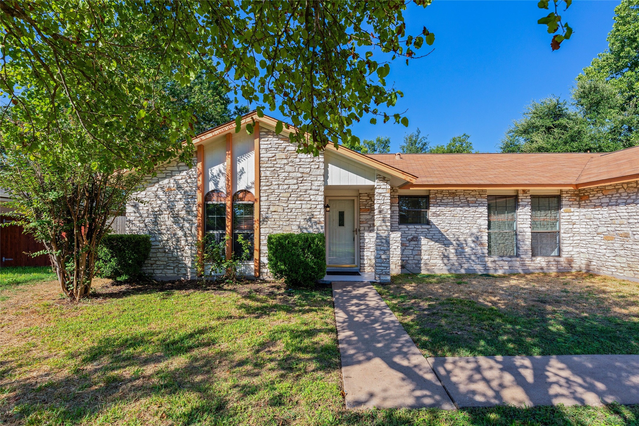 13406 Effingham Street Austin, TX 78729 - Photo 32 of 32 front view of a house with a yard