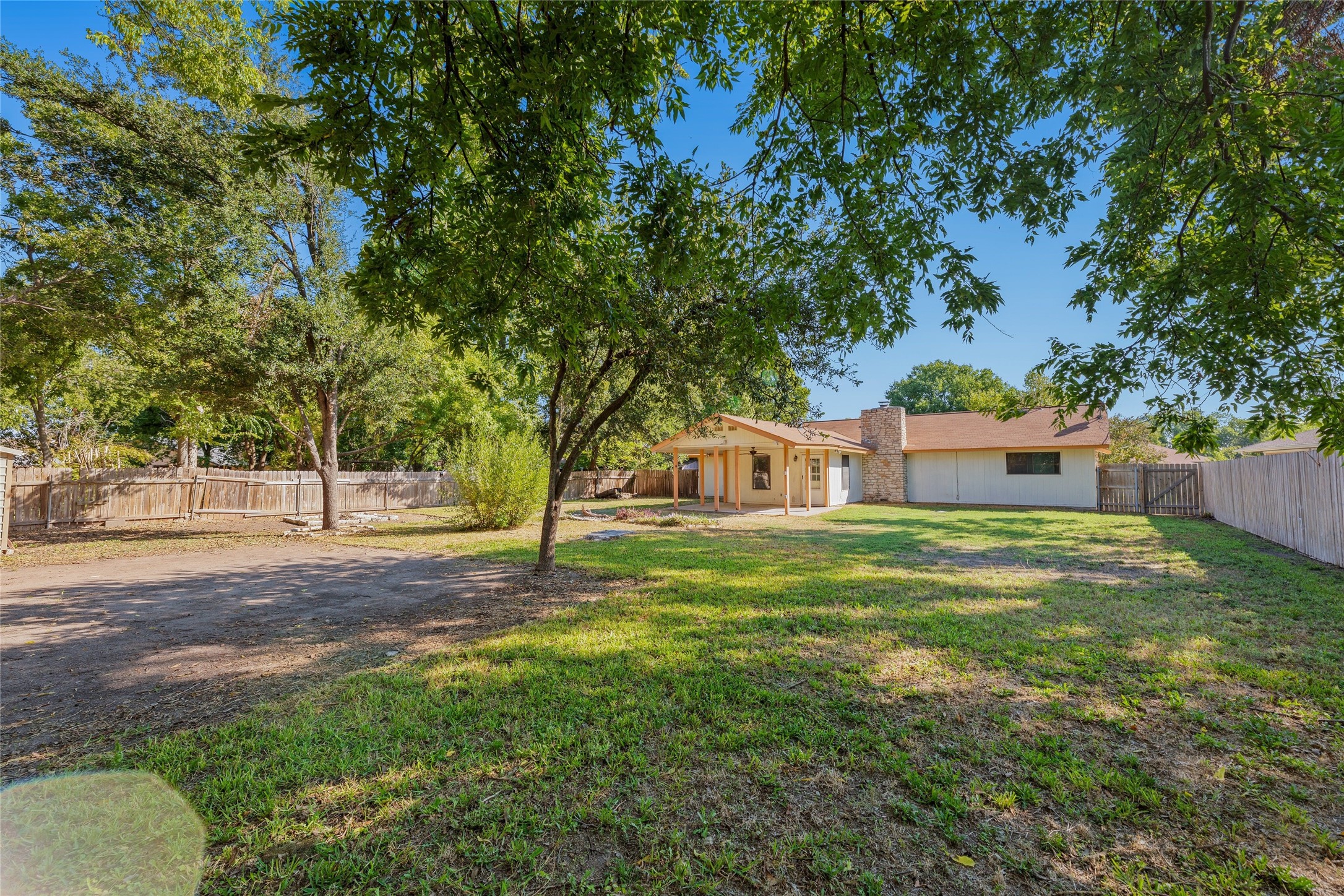 13406 Effingham Street Austin, TX 78729 - Photo 5 of 32 a view of a house with a yard