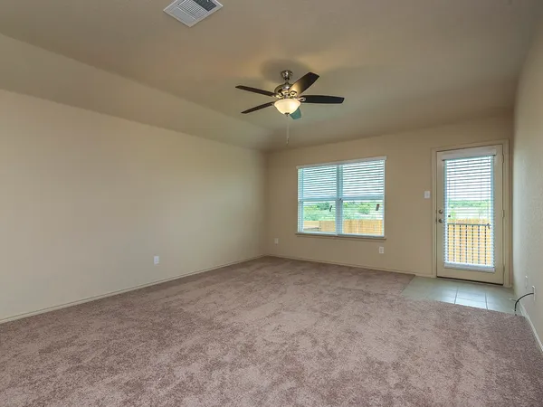 a view of an empty room with a window