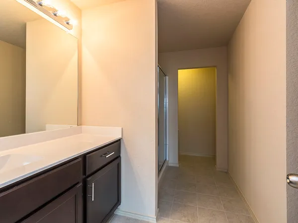 a room with a sink and a mirror