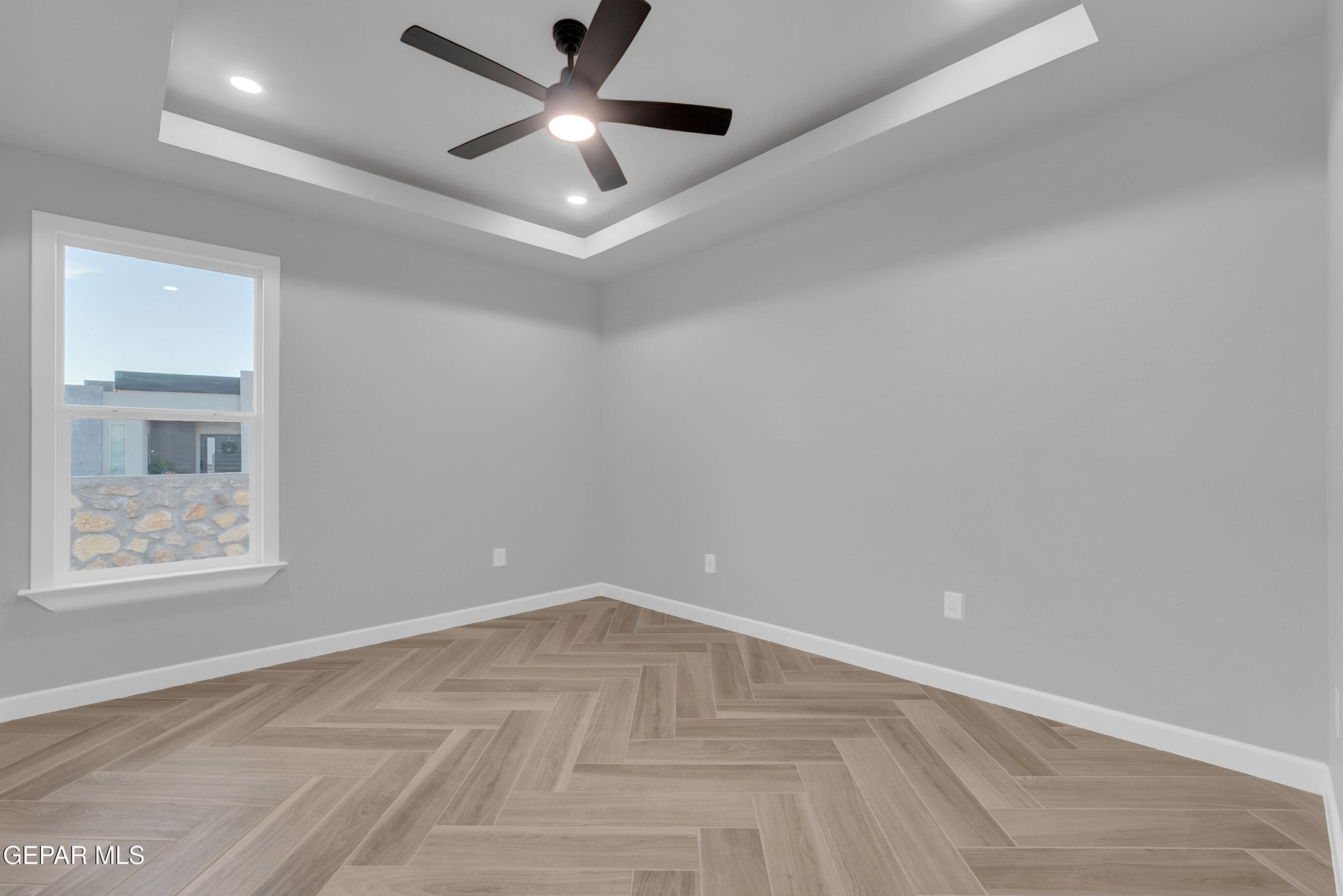 5612 Rio Bonito Circle El Paso, TX 79932 - Photo 46 of 79 an empty room with wooden floor and windows
