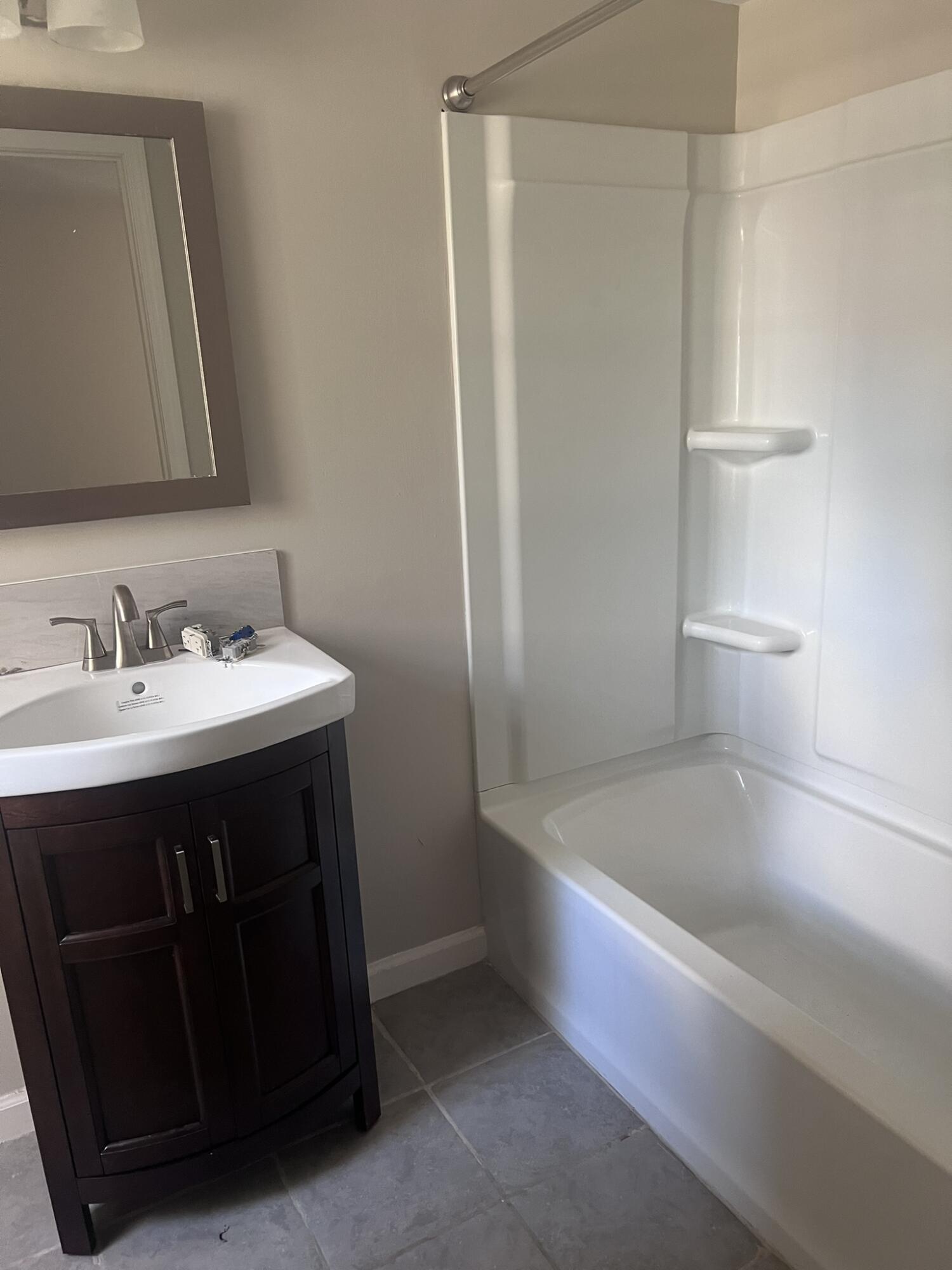 2363 Susan Drive Crestview, FL 32536 - Photo 5 of 16 a bathroom with a sink a toilet and shower