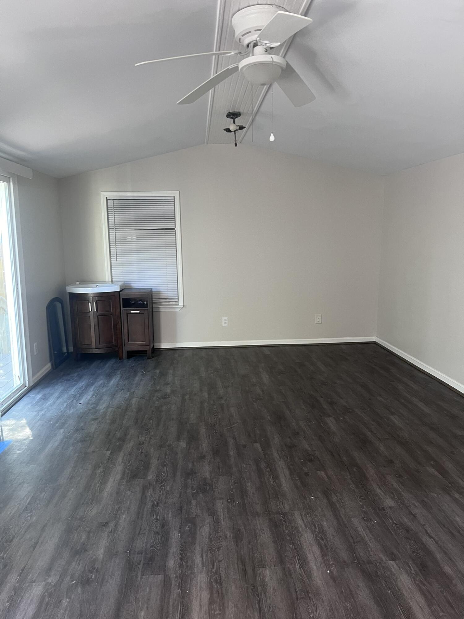 2363 Susan Drive Crestview, FL 32536 - Photo 7 of 16 a view of a room with wooden floor and cabinet