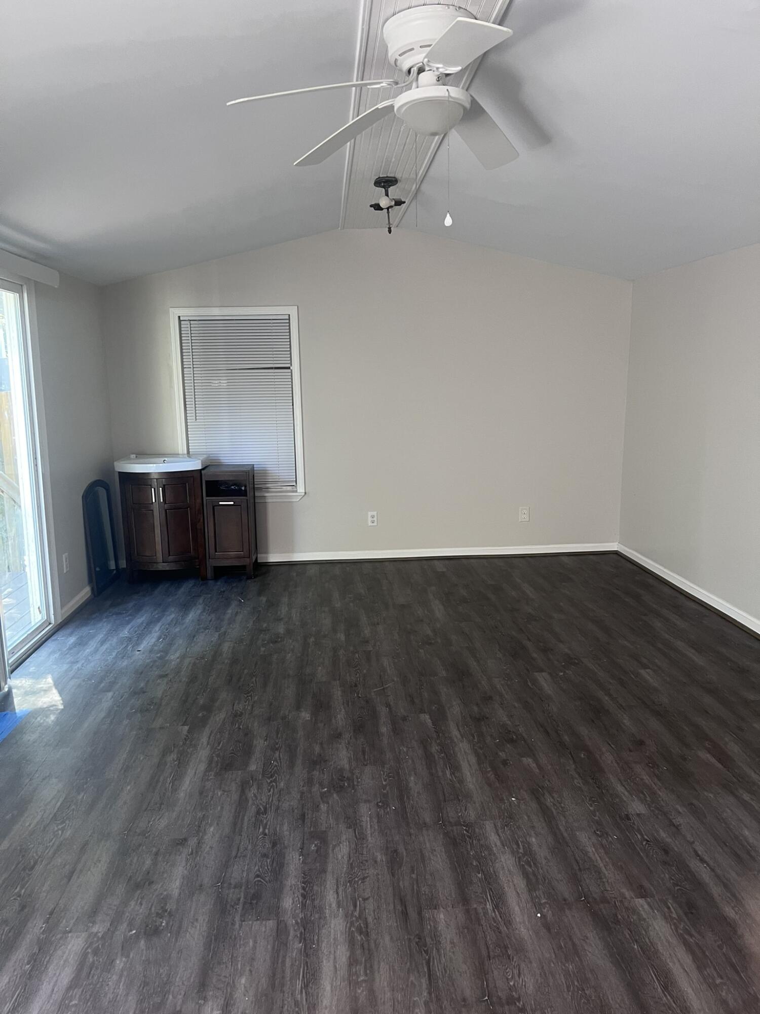 2363 Susan Drive Crestview, FL 32536 - Photo 8 of 16 wooden floor in an empty room with a window