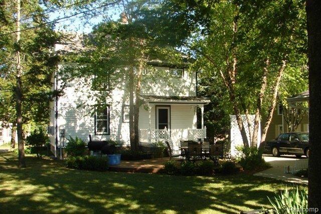 3858 North Mill Road Dryden, MI 48428 - Photo 18 of 21 Backyard of home with deck.jpg