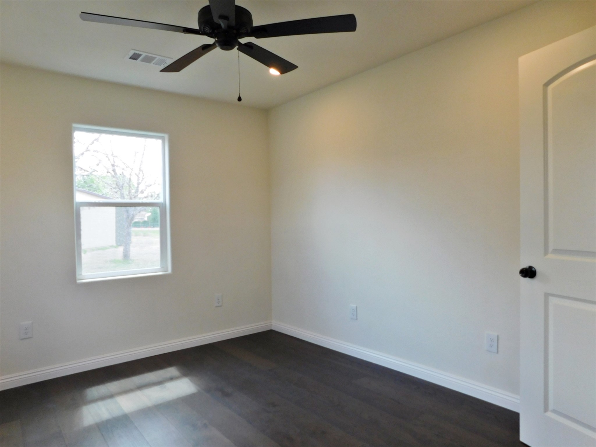 205 East Train Street Ellinger, TX 78938 - Photo 19 of 27 an empty room with a window