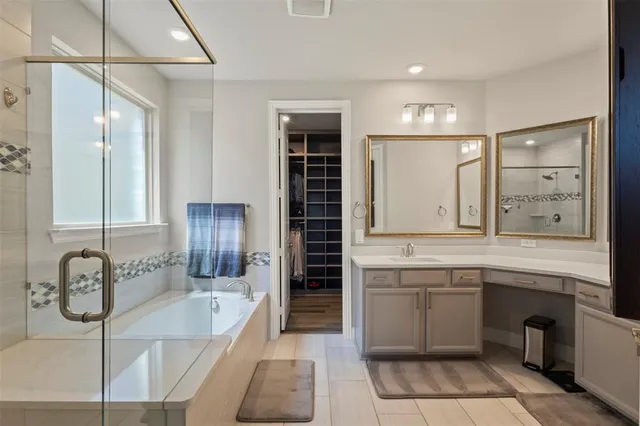 a bedroom with a bed and flat screen tv