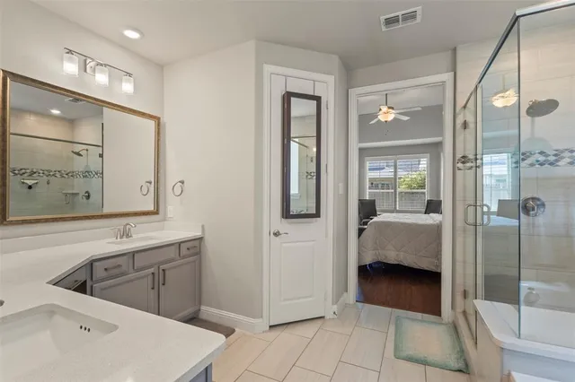 a en suite bathroom with a tub shower and window