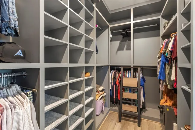 a en suite bathroom with a granite countertop sink mirror and shower