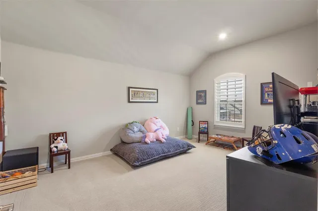 a view of a livingroom with furniture and white walls