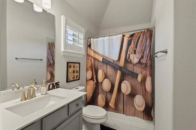 a bedroom with furniture and a flat screen tv