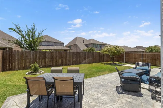 a bathroom with a sink vanity granite and a mirror