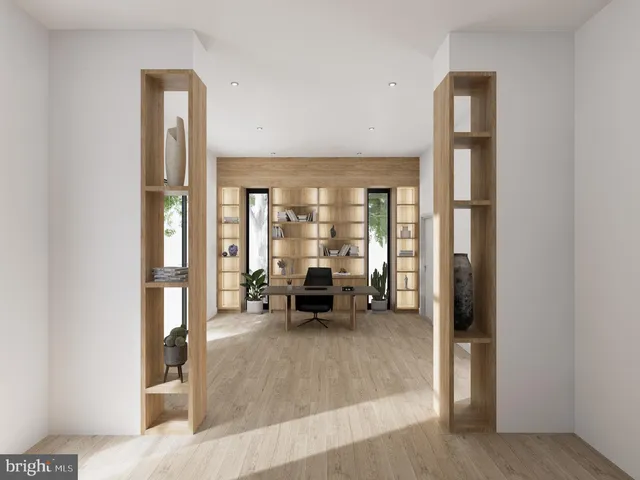 a living room with furniture and large windows