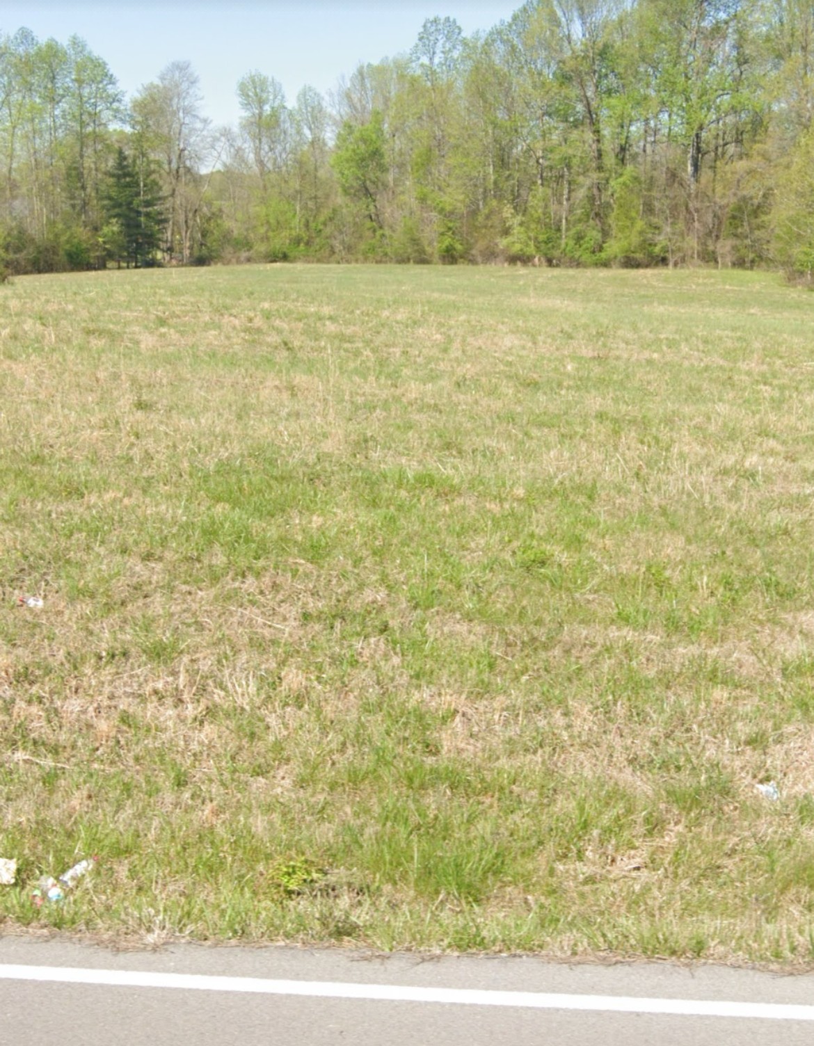 a view of a field with an outdoor space
