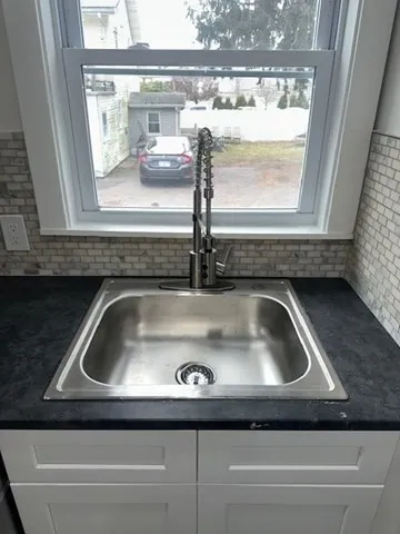 a close view of sink and mirror