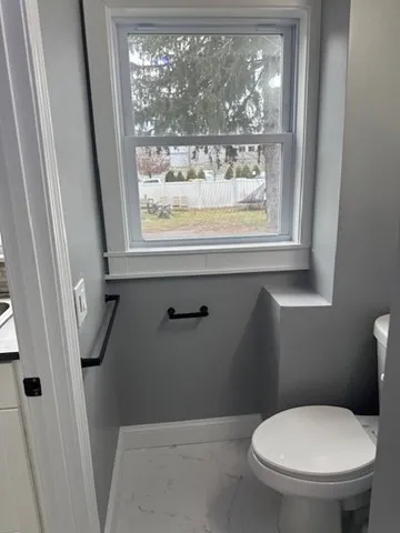 a house that has a window in front of it