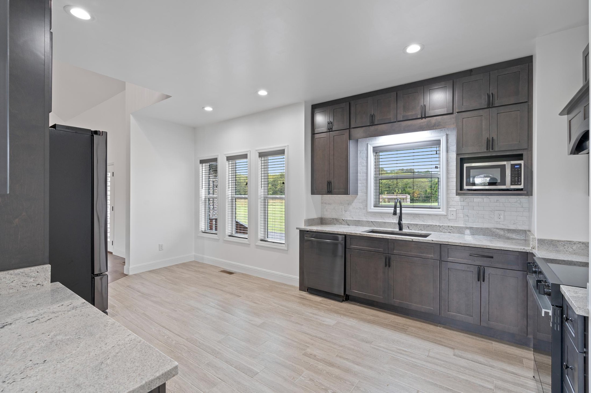 28 Henderson Road Lynchburg, TN 37352 - Photo 13 of 50 a large room with a large window and stainless steel appliances