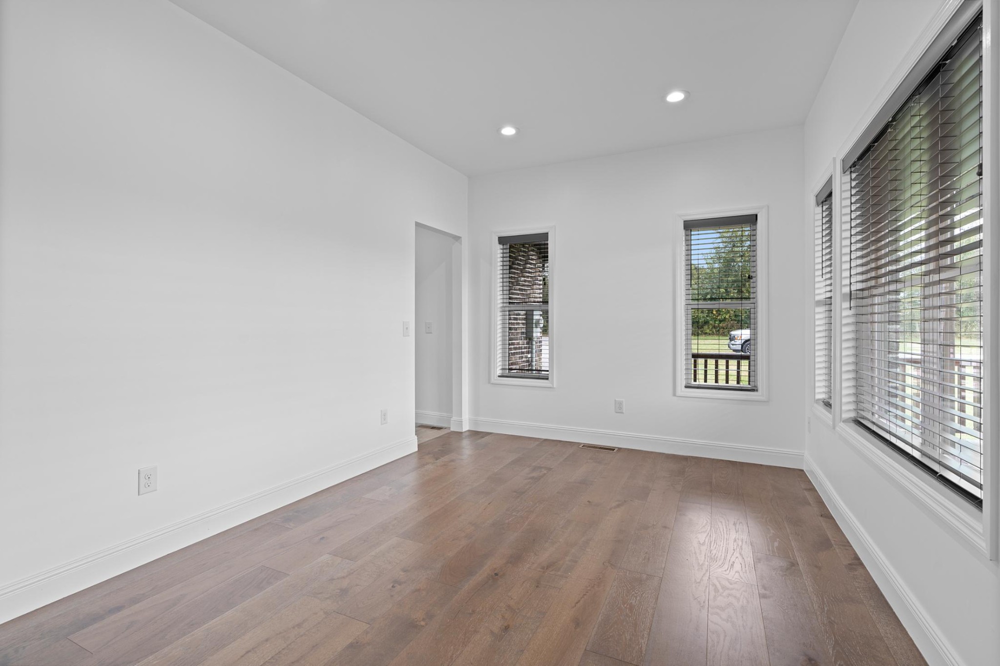 28 Henderson Road Lynchburg, TN 37352 - Photo 14 of 50 an empty room with wooden floor and windows