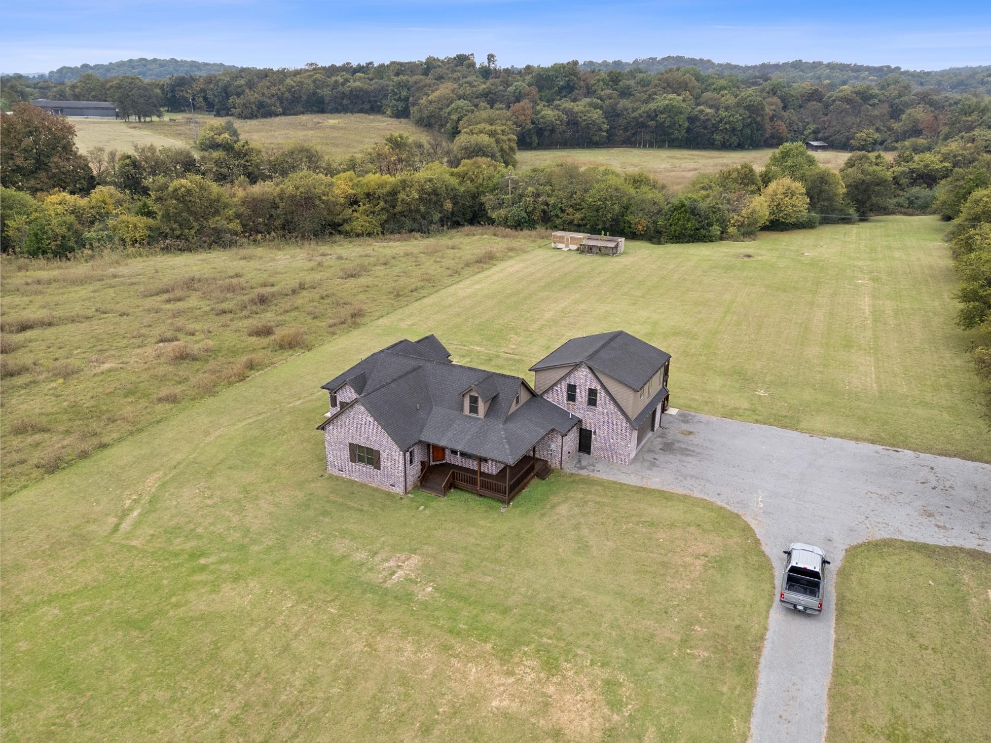28 Henderson Road Lynchburg, TN 37352 - Photo 2 of 50 a aerial view of a house with a yard and a lake view
