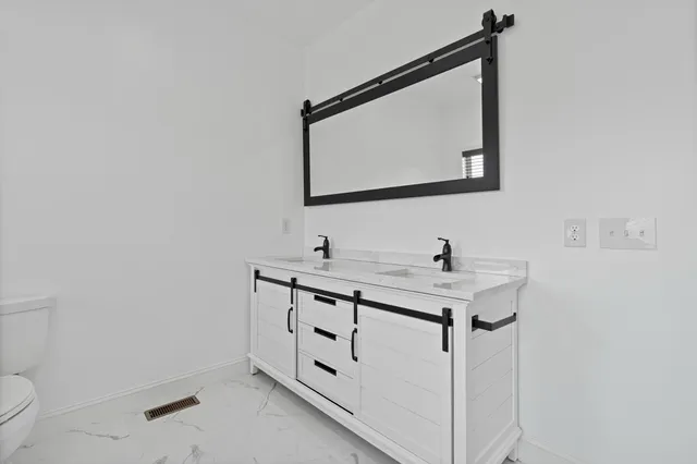 a bathroom with a shower and a bath tub