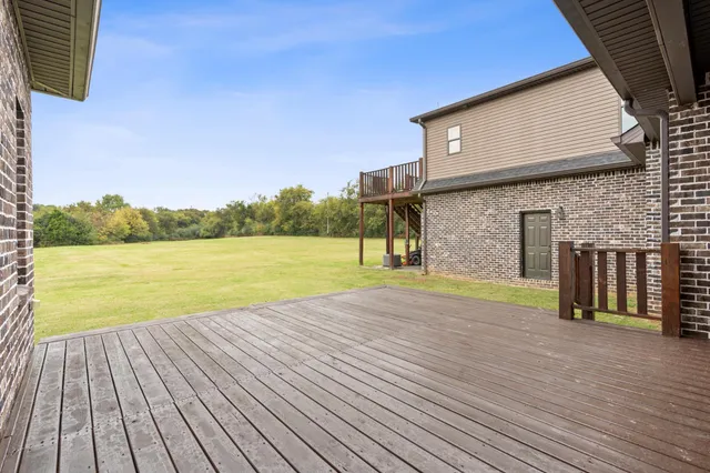 a view of a patio with a table and chairs