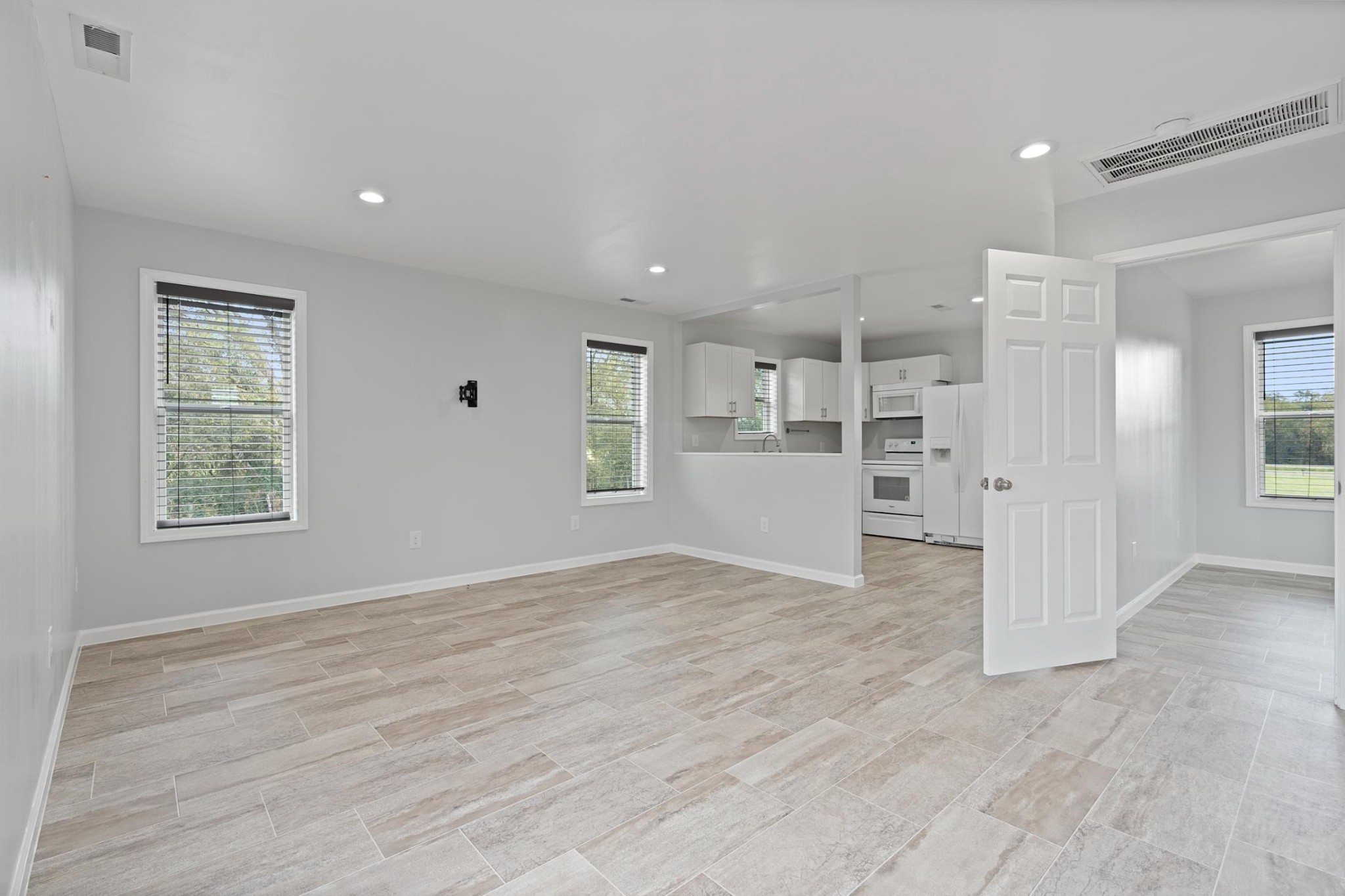 28 Henderson Road Lynchburg, TN 37352 - Photo 32 of 50 an empty room with wooden floor and windows