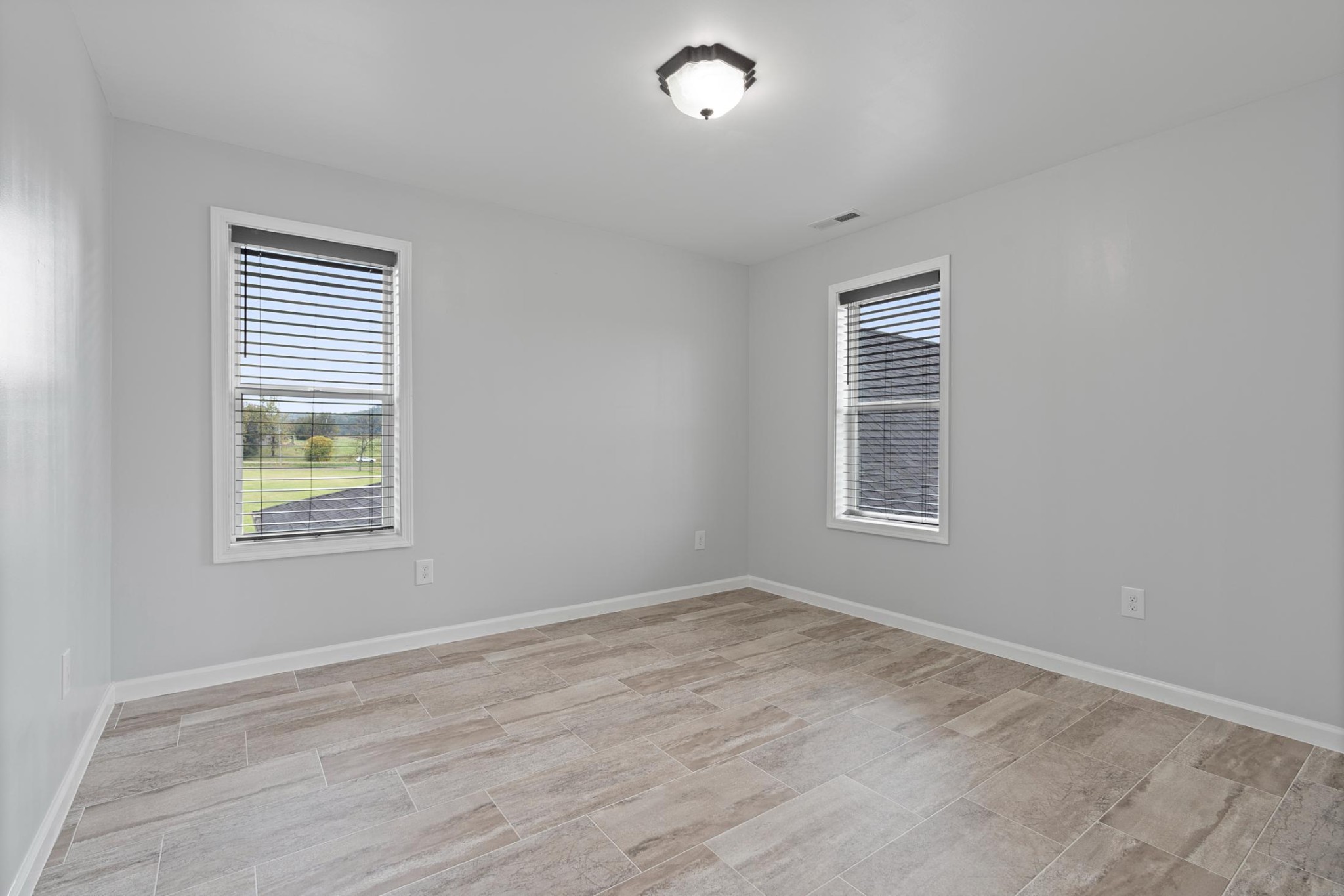 28 Henderson Road Lynchburg, TN 37352 - Photo 35 of 50 a view of an empty room with wooden floor and a window