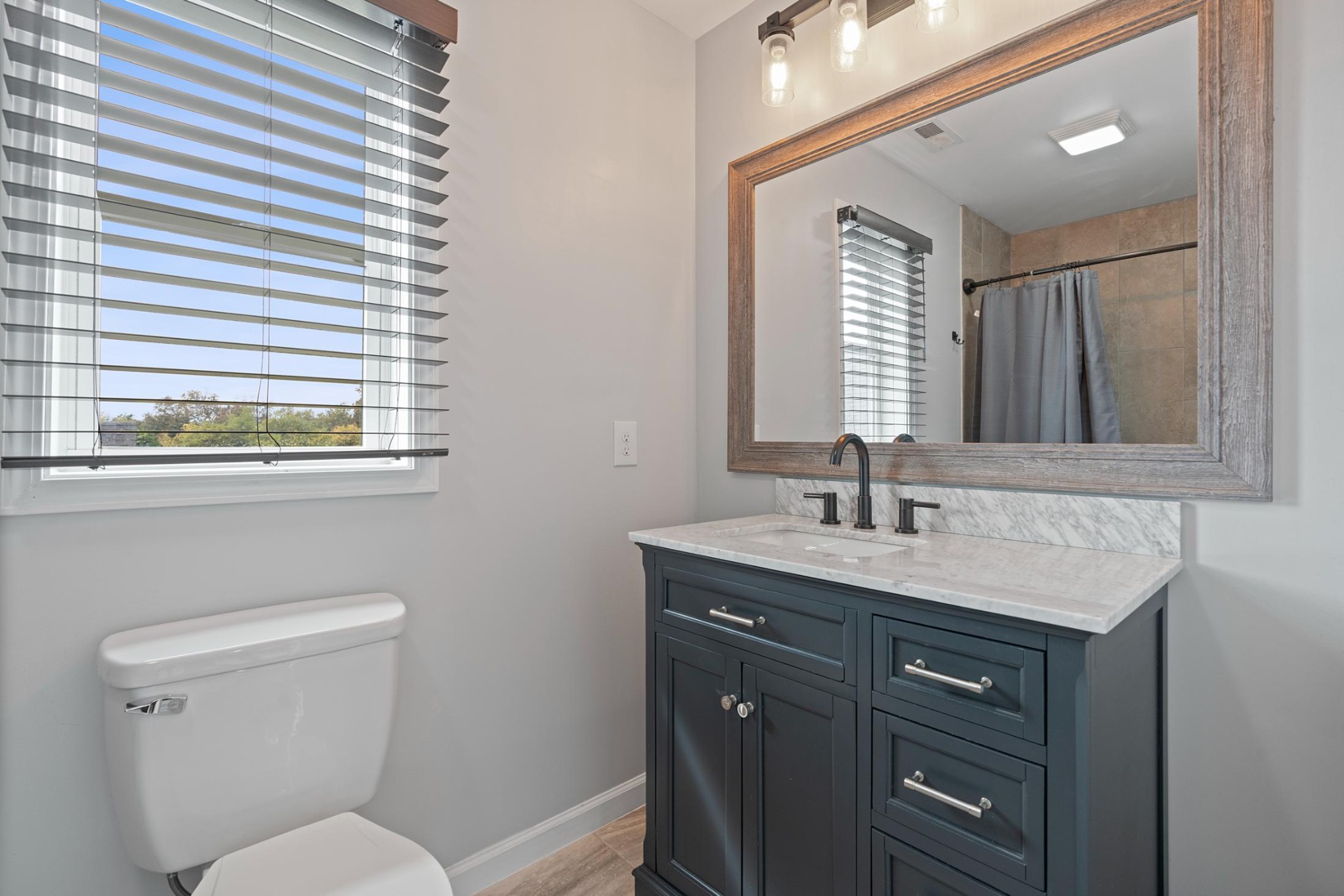 28 Henderson Road Lynchburg, TN 37352 - Photo 37 of 50 a bathroom with a toilet sink and mirror