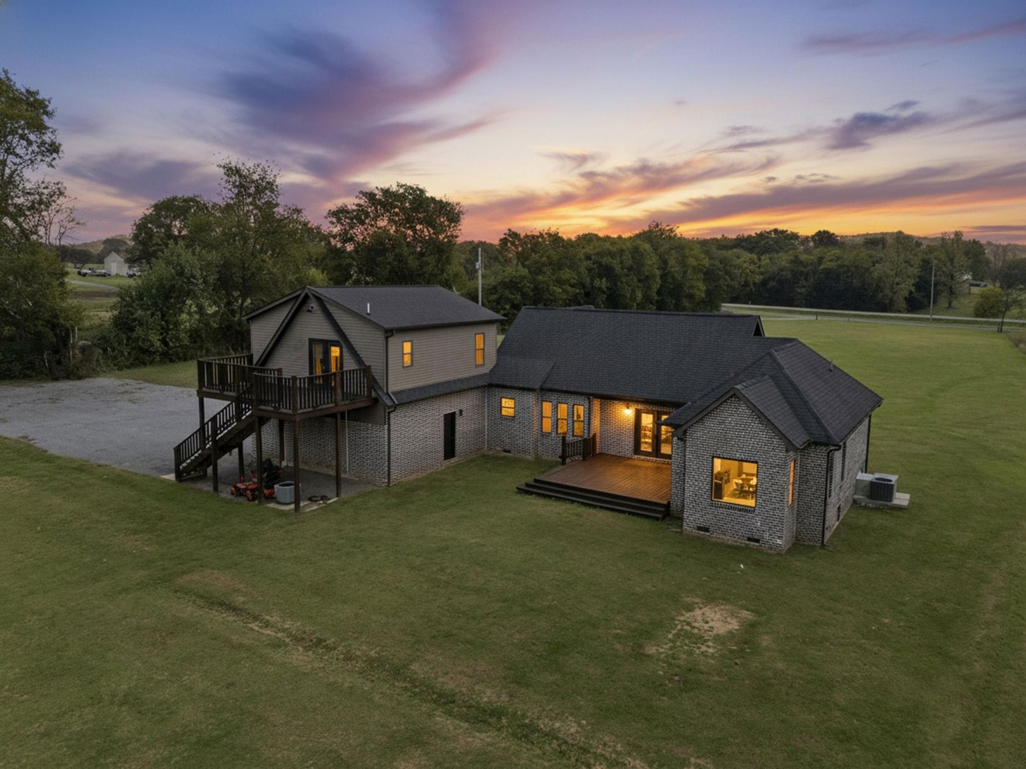 28 Henderson Road Lynchburg, TN 37352 - Photo 4 of 50 a view of a big house with a big yard and large trees