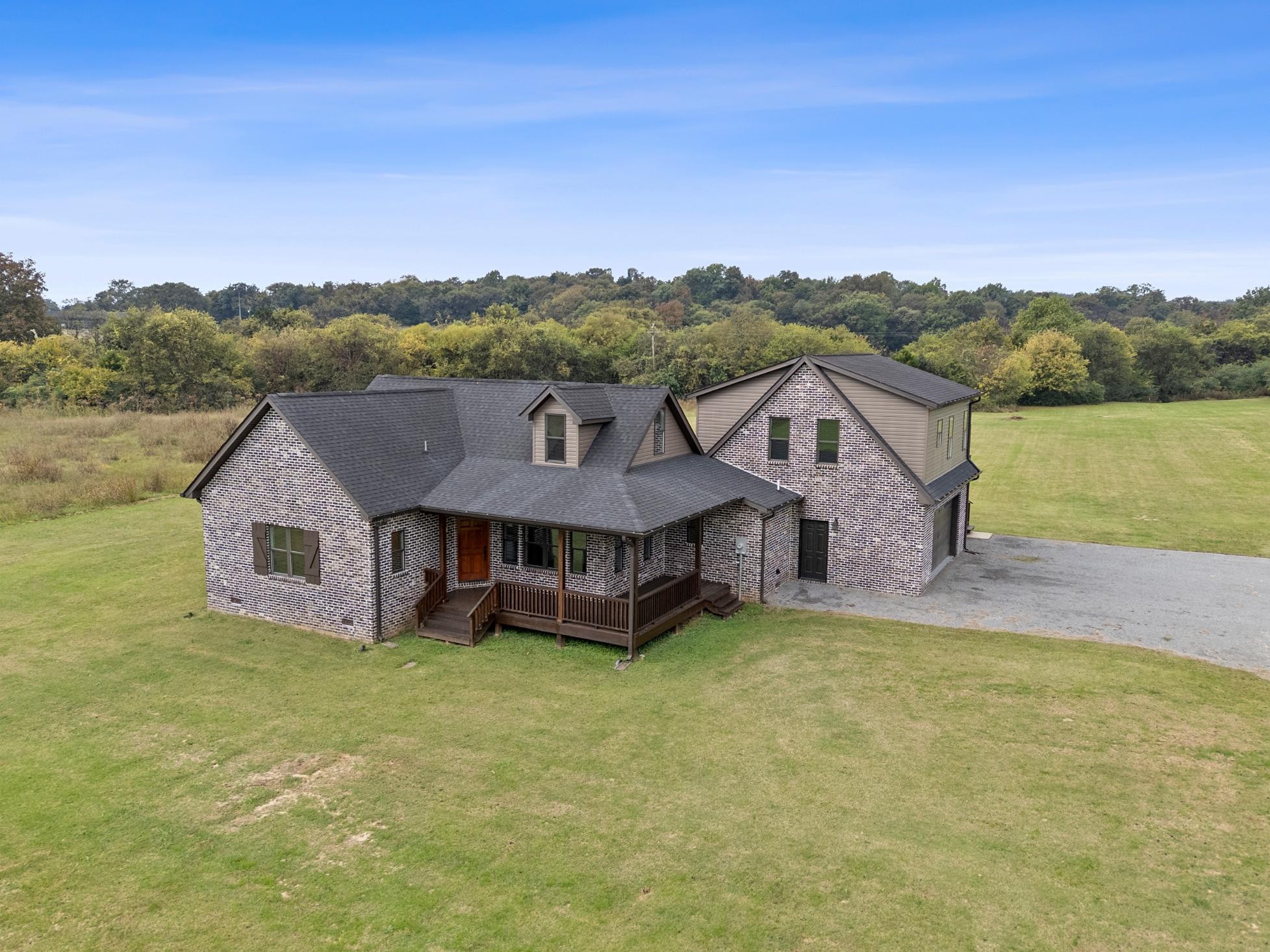 28 Henderson Road Lynchburg, TN 37352 - Photo 43 of 50 an aerial view of a house with a garden and a yard