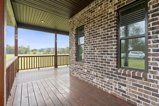 a large room with a large window and stainless steel appliances