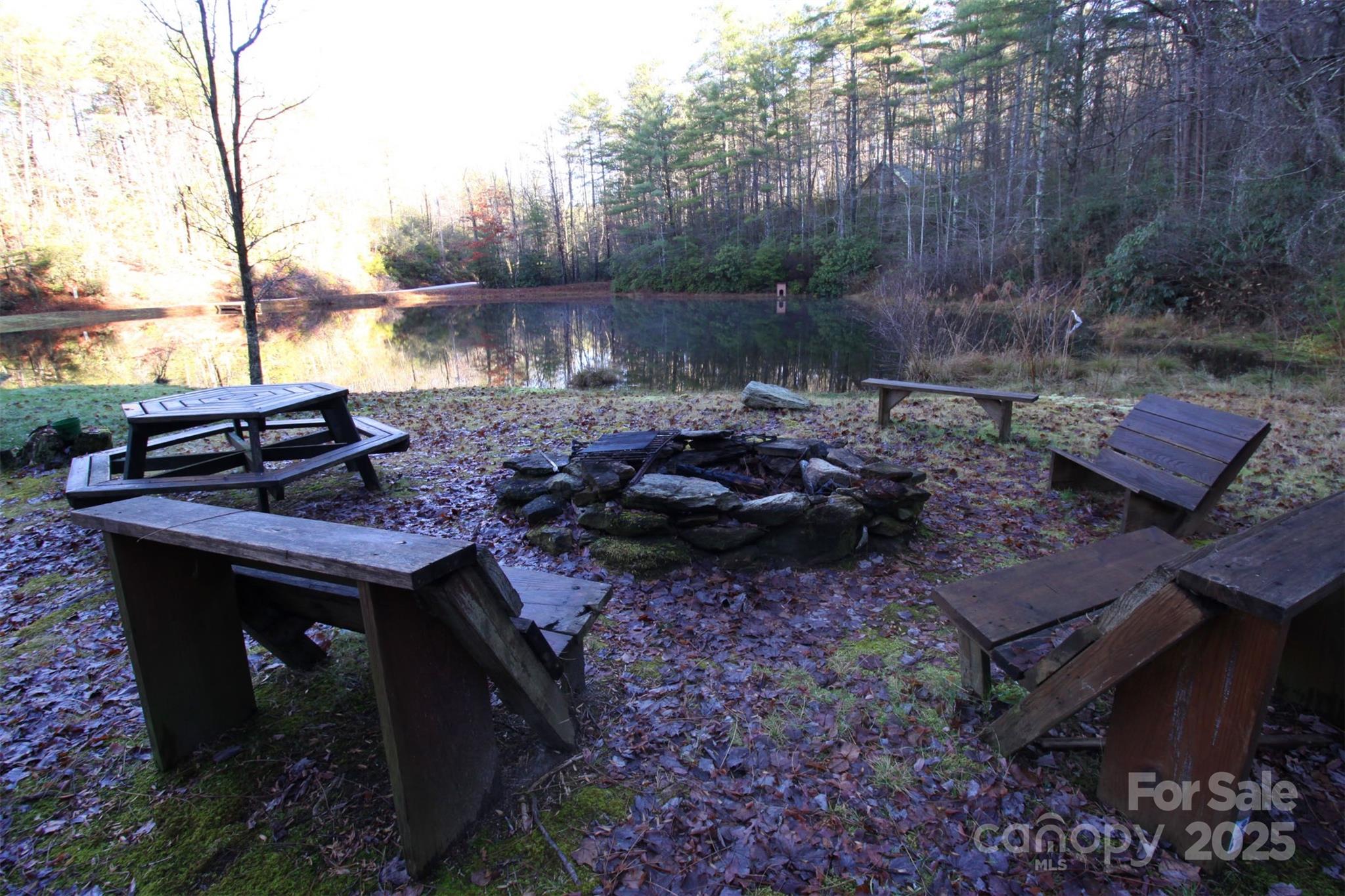 Lot 16 Arrowhead Ridge, Unit 16R Brevard, NC 28712 - Photo 15 of 18 a view of a fire pit with a yard