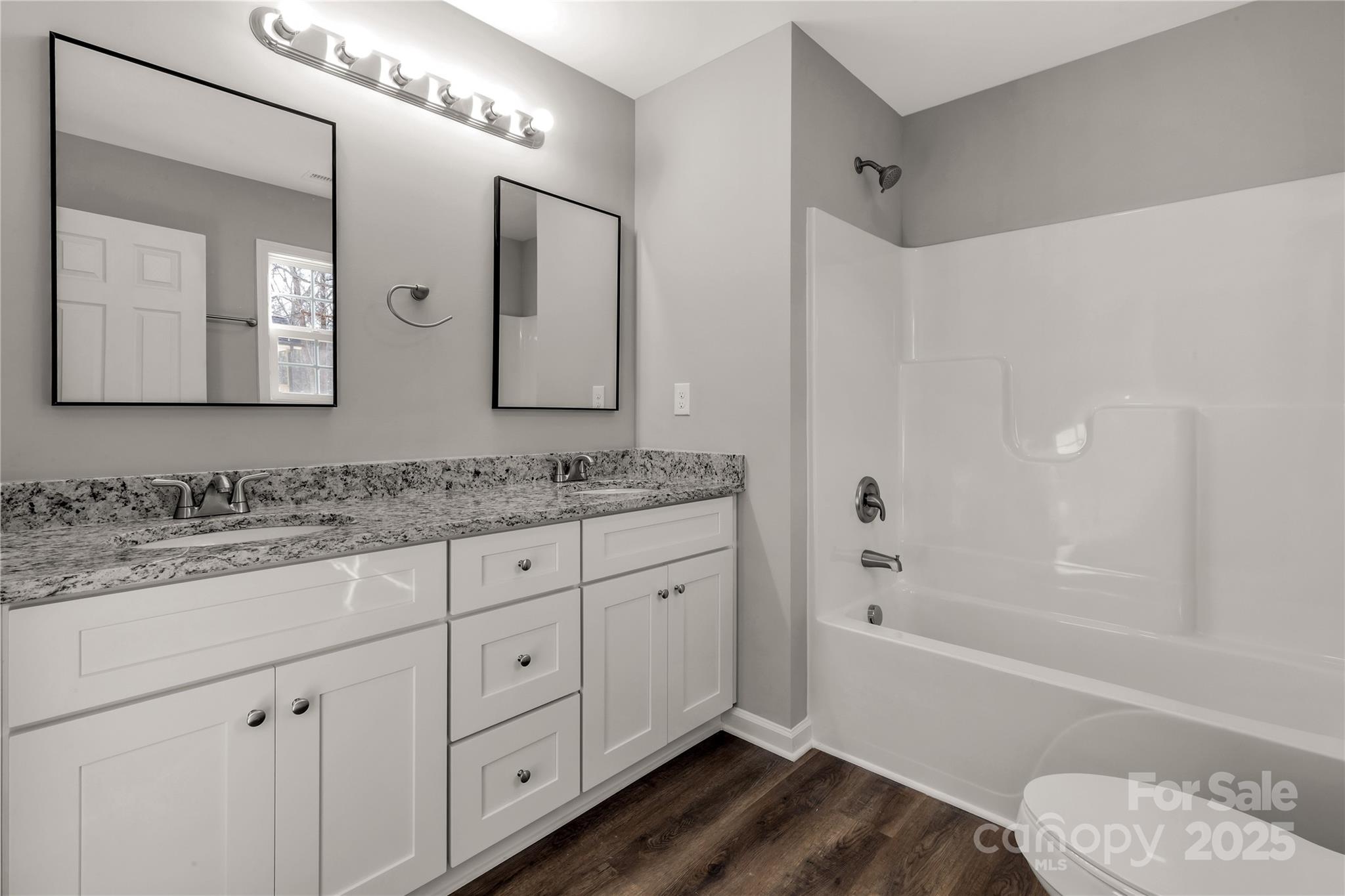 970 Helms Street Rock Hill, SC 29732 - Photo 26 of 32 a bathroom with a granite countertop sink mirror and bathtub