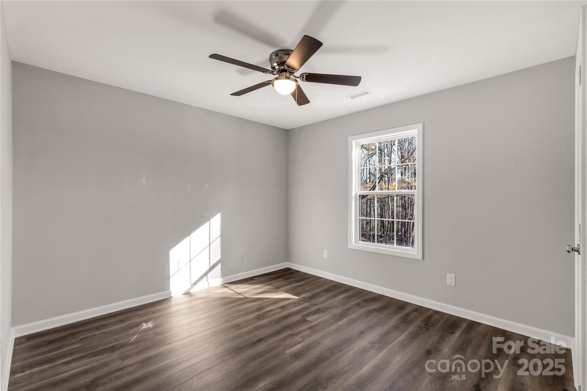 970 Helms Street Rock Hill, SC 29732 - Photo 28 of 32 a view of an empty room with wooden floor and a window