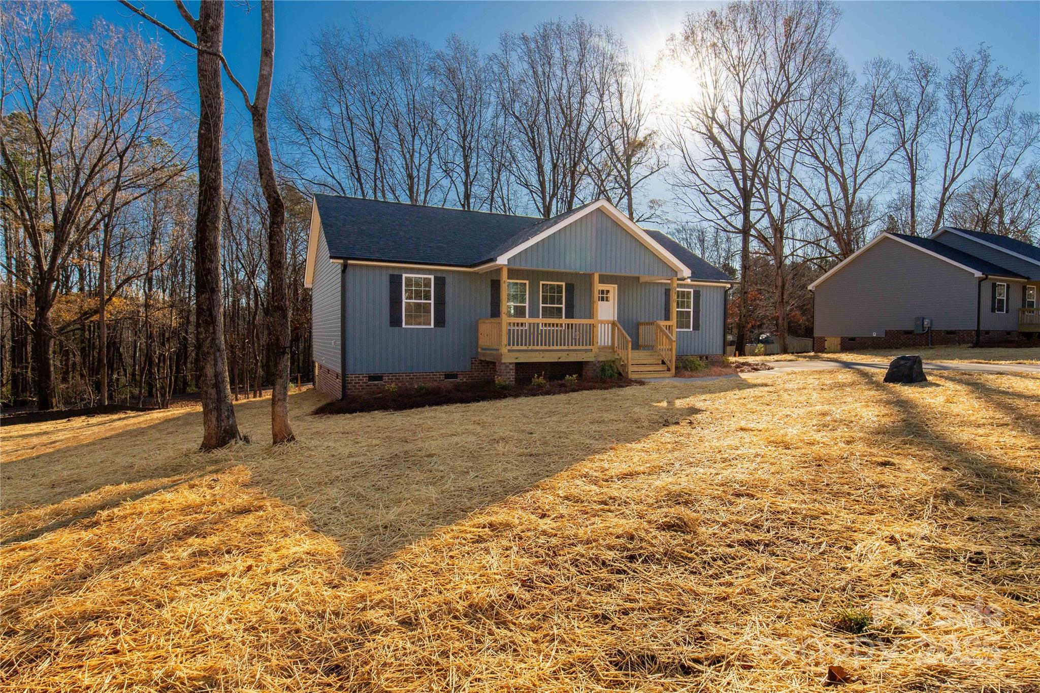970 Helms Street Rock Hill, SC 29732 - Photo 3 of 32 a front view of a house with a yard covered in snow