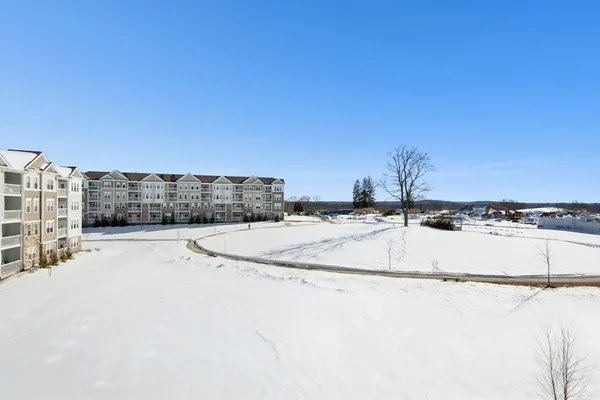 a view of a swimming pool with a yard