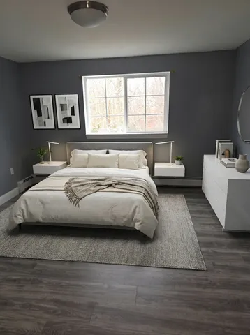 a bedroom with a large bed and a couch