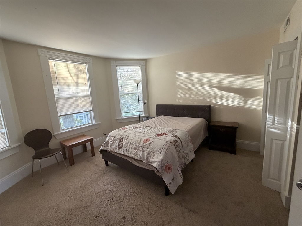11 Francis Street, Unit 2 Malden, MA 02148 - Photo 10 of 12 a bedroom with a bed chair and window