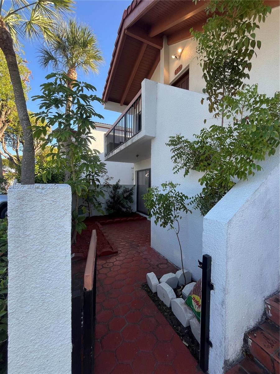 7430 Southwest 153rd Place, Unit 1061 Miami, FL 33193 - Photo 14 of 42 a backyard of a house with lots of green space