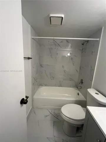 a kitchen with stainless steel appliances granite countertop a sink and a stove