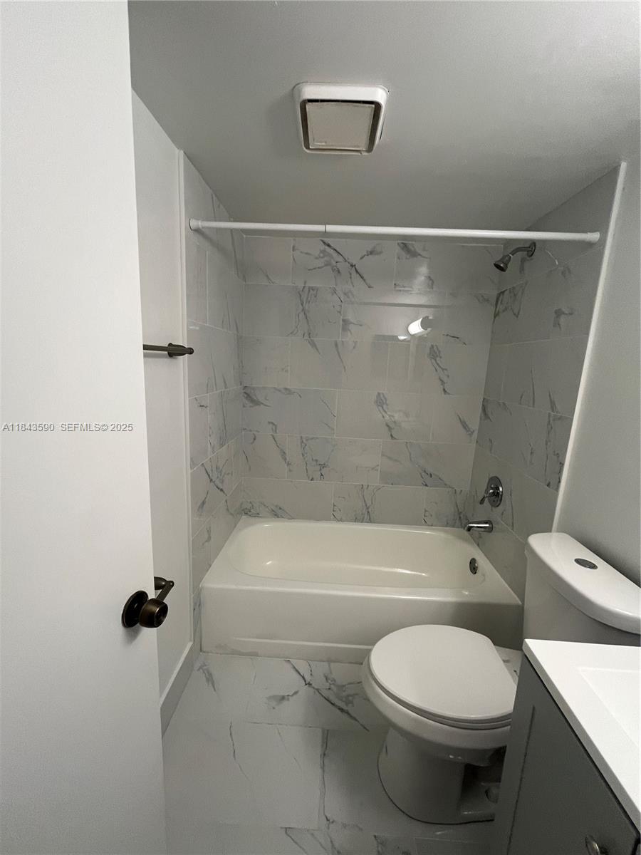 7430 Southwest 153rd Place, Unit 1061 Miami, FL 33193 - Photo 18 of 42 a bathroom with a toilet and a shower