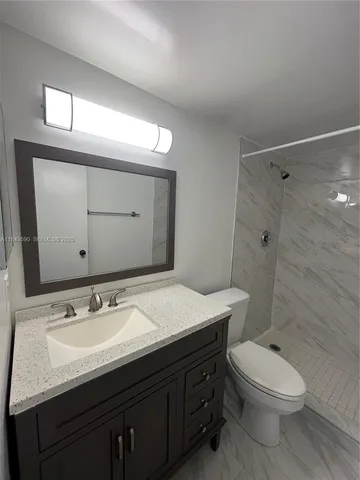 a kitchen with stainless steel appliances granite countertop a refrigerator sink and cabinets