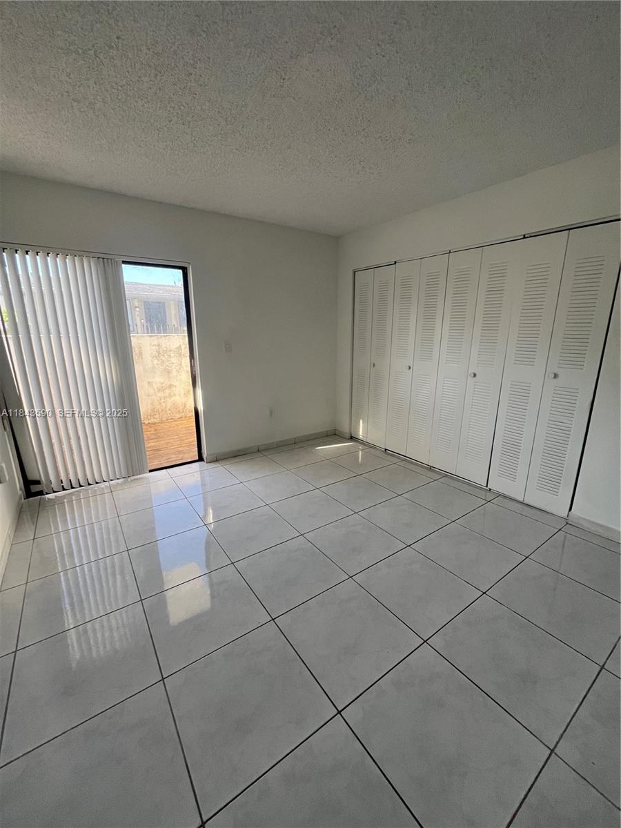 7430 Southwest 153rd Place, Unit 1061 Miami, FL 33193 - Photo 24 of 42 a view of an empty room and window
