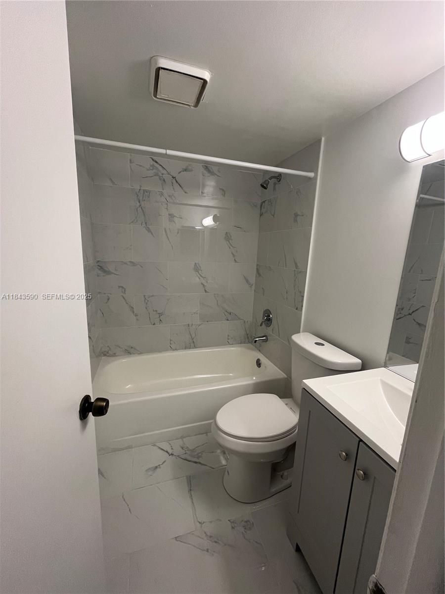 7430 Southwest 153rd Place, Unit 1061 Miami, FL 33193 - Photo 27 of 42 a bathroom with a sink toilet and shower