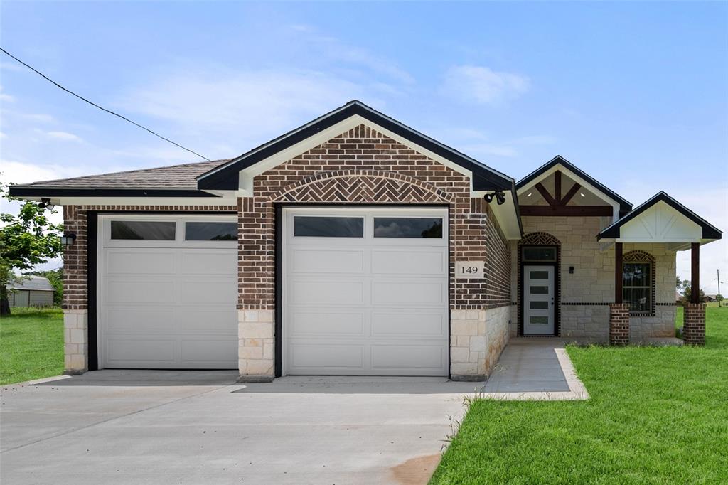 149 L B J Ranch Road Trinidad, TX 75163 - Photo 3 of 31 View of front of house with driveway, a garage, brick siding, a front lawn, and a shingled roof