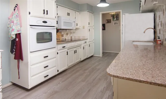 a bathroom with a sink a mirror and a window
