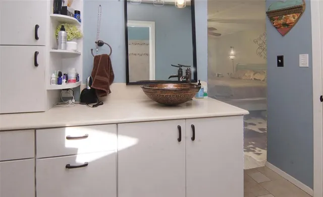 a bedroom with a bed and a table in it